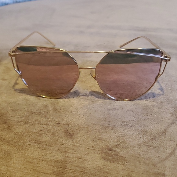 Accessories - rose gold aviator-style sunglasses with gradient or reflective lenses.